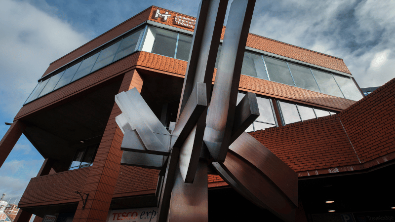 Metal sculpture with Leicester Haymarket Theatre in the background